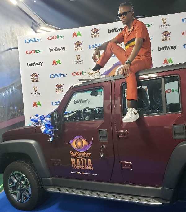 Laycon Poses On His SUV Car Won From BBNaija