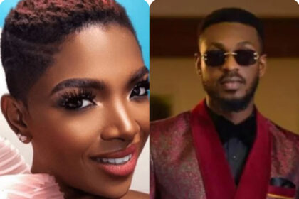 Adekunle standing on stage with Annie Idibia during a playful moment at AFRIMA 2026.