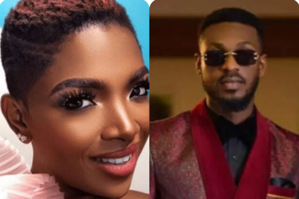 Adekunle standing on stage with Annie Idibia during a playful moment at AFRIMA 2026.